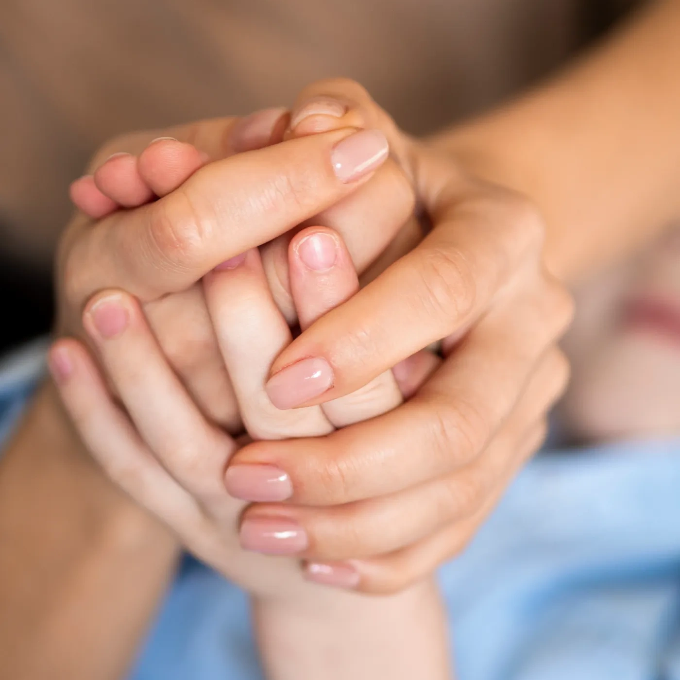 close-up-mother-son-holding-hands